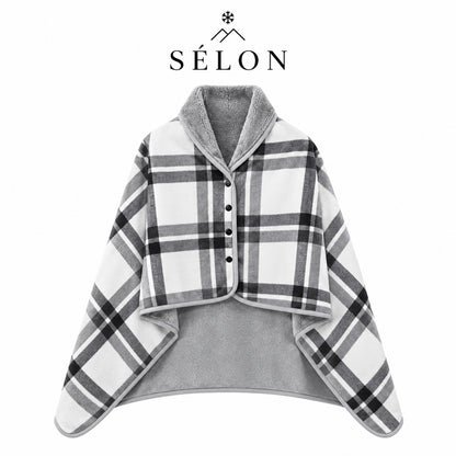 Cream and black check flannel shawl laid flat over a grey fleece lining
